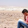 Fifteen year old Mohammad sits in front of the Azraq refugee camp in Jordan, where he lives with his family and goes to a UNICEF supported school. He fled in 2015 when the conflict in his hometown in the Golan Heights in south-western Syria intensified.