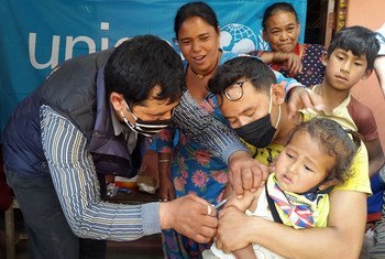 Child being vaccinated in Nangavare, Nepal.