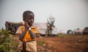 A young boy from Burundi, forced to flee his home due to violence, looks at his new surroundings in the Nyarugusu refugee camp in Tanzania.