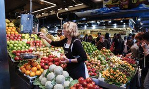 A fruit seller in Barcelona, Spain. Export subsidies and other similar measures are often seen as distorting global trade.