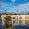 在承办南美洲首次减灾高级别会议的巴拉圭首都亚松森，2014年7月，其远郊地带被洪水淹没。儿基会图片/ Martin Crespo