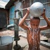 A child washes himself in Kallyanpur, a slum in Bangladesh's capital, Dhaka.