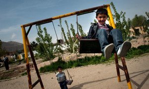 Children play on a swingset on the playground of a day care centre in Kabul, the capital of Afghanistan.