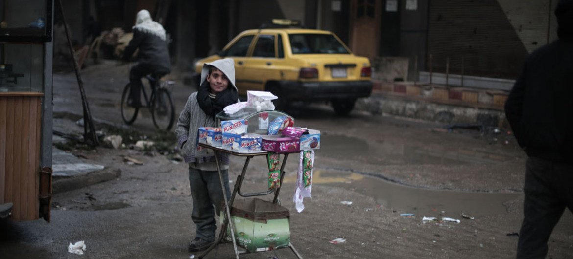 On 5 January 2016, during a school day, 9 year old Ayman sells candies in the streets of Kafar Batna village in Rural Damascus, Syria.