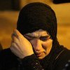 Женщина в ожидании разрешения покинуть осажденый сирийский город Мадая в окресностях Дамаска, январь 2016 г. 