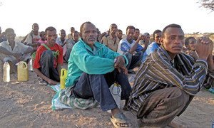 Migrants form queues to be counted by their smuggler prior to being transported by boat from Obock, northern Djibouti, to Yemen.