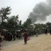 Гражданские лица спасаются  бегством от насилия в районе одной из баз ООН  в Малакале,  Южный  Судан