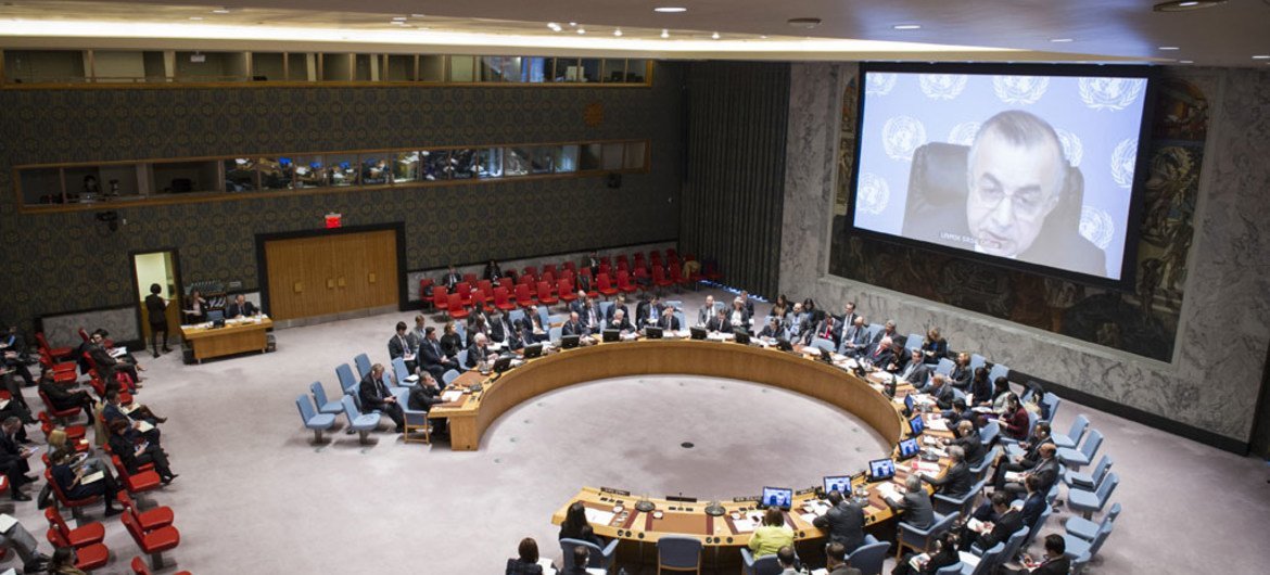 File photo of a wide view of the Security Council, being briefed via video conference by Zahir Tanin (on screen), Head of the UN Interim Administration Mission in Kosovo (UNMIK).