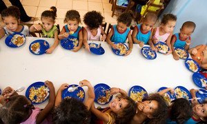 Children eat a meal at their school which is taking part in a school feeding programme in Latin America and the Caribbean.