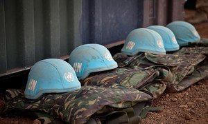 Blue helmets and uniforms of UN Peacekeepers.