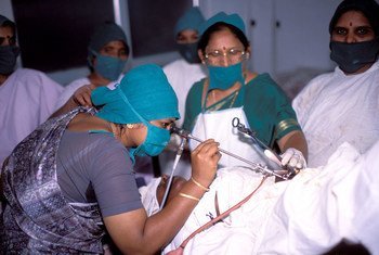 A female doctor at hospital performing an operation at a hospital in India.