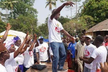 A cross section of some of the people of Tonkolili district in Sierra Leone (in white T-shirts) celebrating their recent discharge, following 21 days monitoring for Ebola.