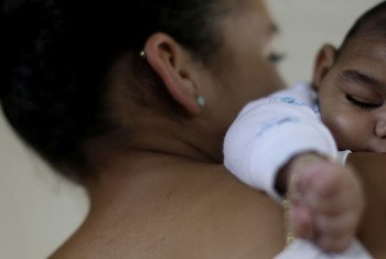 A 15-year-old in Recife, Brazil, holds her a four-month old baby born with microcephaly.