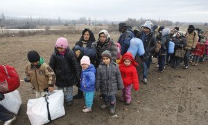On 26 January 2016, refugees and migrants wait to enter the Miratovac Refugee Aid Point in southern Serbia, on the border with the former Yugoslav Republic of Macedonia, after crossing the Mediterranean.