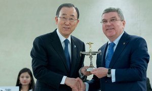 Thomas Bach (right), President of the International Olympic Committee (IOC), presents Secretary-General Ban Ki-moon, on behalf of the UN, with the Olympic Cup Award during in the Olympic Flame Ceremony at the Palais des Nations in Geneva.