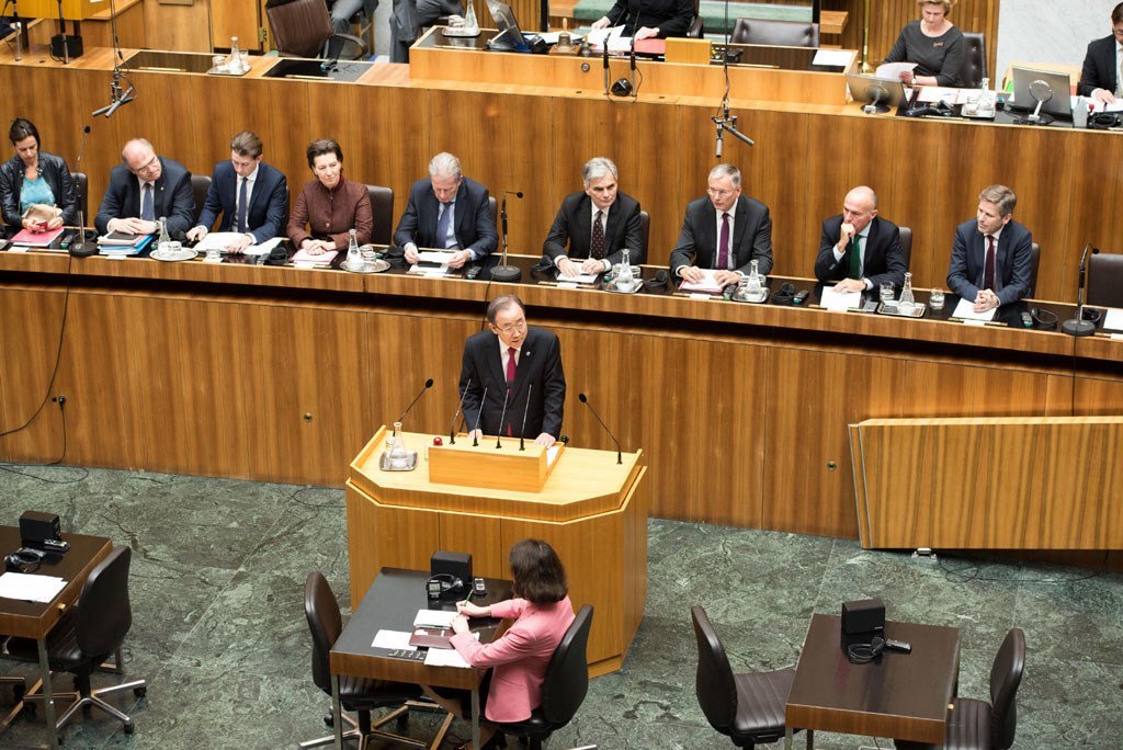 Secretary-General Ban Ki-moon (centre, at lectern) addresses the Austrian Parliament in Vienna.