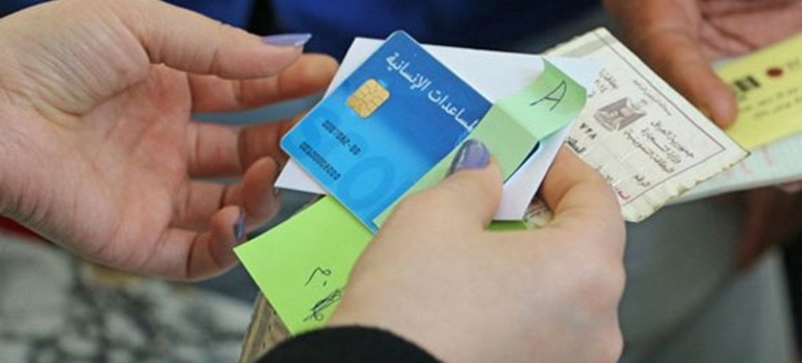 WFP SCOPE card, a digital cash card programme to provide food assistance to thousands of displaced Iraqi families and Syrian refugees across Iraq.
