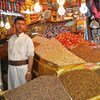 A vendor in his shop for selling nuts in old Sanaía city, Yemen.