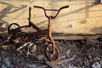 A bicycle, damaged by fire, sits on a third-floor balcony of a destroyed building, in the north-western city of Misrata, Libya.
