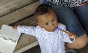 One-year-old Ami Yin Silva at the San Jose de Chamanga shelter in Ecuador, which was built at an intersection that forms a "Y" between the Troncal del Pac’fico highway and the entry road to San Jose de Chamanga Parish. UNICEF/UN018164/Reinoso