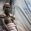 一位来自布隆迪的母亲和她的孩子在坦桑尼亚的一个难民营。难民署图片/Sebastian Rich