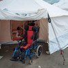 A 9-year-old disabled boy’s wheelchair stands at the entrance of the tent where he and his family are living since the April 2016 earthquake destroyed their house in Portoviejo, Manabi, Ecuador.