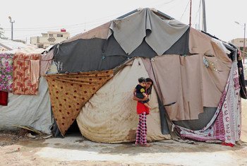 The family living in this tent in Baghdad, Iraq, explained that the camp and the tents were not ready for winter. September 2015.
