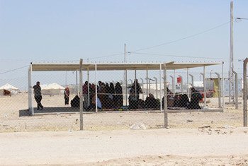 On 30 May 2016 in Anbar Province, Iraq, displaced people from Fallujah wait for a distribution in the Al Iraq Camp, one of over two dozen sub-camps within Ameriyat al-Fallujah camp.