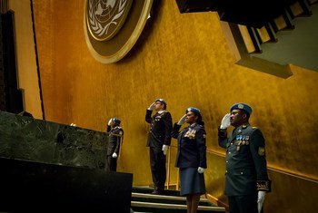 A view of UN Police (UNPOL) officers at the opening of the United Nations Chiefs of Police Summit (UN COPS), a historic gathering of more than 100 police leaders from around the world. The officers salute as a minute of silence is observed for fallen UN P