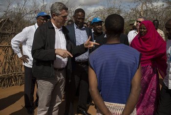UN High Commissioner for Refugees Filippo Grandi talks to a Somali refugee family during his visit in Ifo Camp in Dadaab, Kenya.