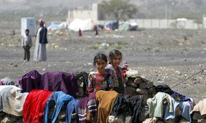 In Yemen, internally displaced children stand outside their family tent after the family fled their home in Saada province and found refuge in Darwin camp, in the northern province of Amran.