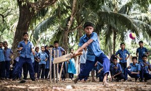 Rakib Hosain Sabbir, aged 9, a fourth grade student bats during a cricket game at Labsha Government Primary School in Satkhira Sadar, Bangladesh.