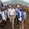 Operations Director of the Office of the Coordination of Humanitarian Affairs (OCHA), John Ging (centre), walks around the Kanaba IDP site in the Democratic Republic of the Congo (DRC) during a visit on 24 June 2016.