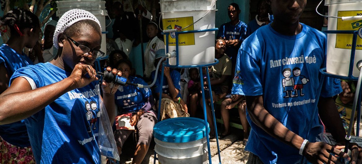 As part of joint efforts between the UN and the Government of Haiti to fight cholera, water filter systems are distributed in Cité Soleil, Port au Prince.