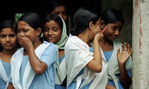 Students laugh as they leave school in Bangladesh.