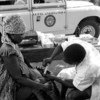A technician vaccinates a small child, February 1964, in Togo, where the Government carried out an extensive anti-yaws campaign, assisted by experts from the World Health Organization. UNICEF supplied the equipment.