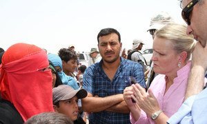 UN Humanitarian Coordinator for Iraq, Lise Grande (right), in conversation with refugees coming our of Iraq.