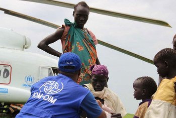 This photo from November 2014 shows IOM providing transportation assistance in South Sudan, moving vulnerable refugees on a UNHCR helicopter.