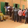 Voters line up at a polling station during the 21 February 2016 general elections in Niger.