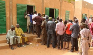 Voters line up at a polling station during the 21 February 2016 general elections in Niger.
