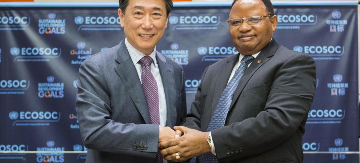 Outgoing ECOSOC President Oh Joon of the Republic of Korea (left), greets his successor Frederick Musiiwa Makamure Shava of Zimbabwe.