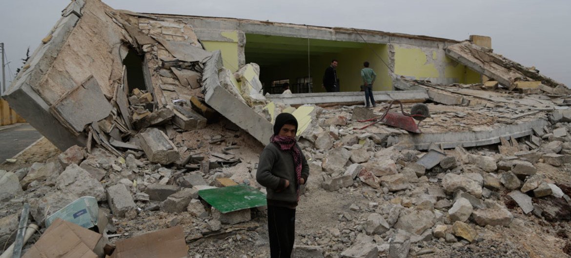 A child standing in front of his ground-flattened school after a bombardment in Ainjara village in rural Aleppo, Syria.