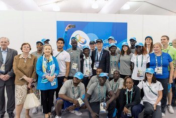 Secretary-General Ban Ki-moon (centre) meets with the Olympic Refugee Team at the Olympic Village in Rio de Janeiro, Brazil.