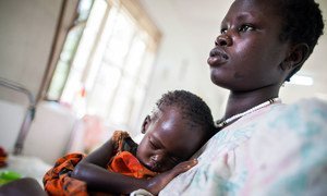 A mother holds her severely malnourished 22-month-old baby in the Al Sabah children's hospital in Juba, South Sudan, while awaiting treatment at the UNICEF-supported nutrition ward.
