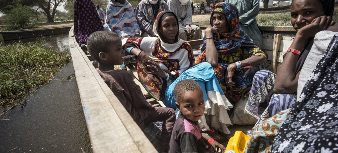 Nigerian refugees leave their camp in Ngouboua, on the coast of Lake Chad, in this image from February 2015.