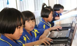 Young students learn their computer skills to prepare themselves for the future. Chiang Rai, Thailand, January 2012.