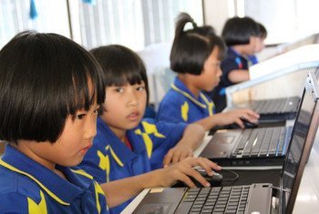 Young students learn their computer skills to prepare themselves for the future. Chiang Rai, Thailand, January 2012.
