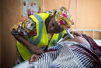 A nurse and a survivor of the Boko Haram insurgency at an antenatal check-up in north-eastern Nigeria.