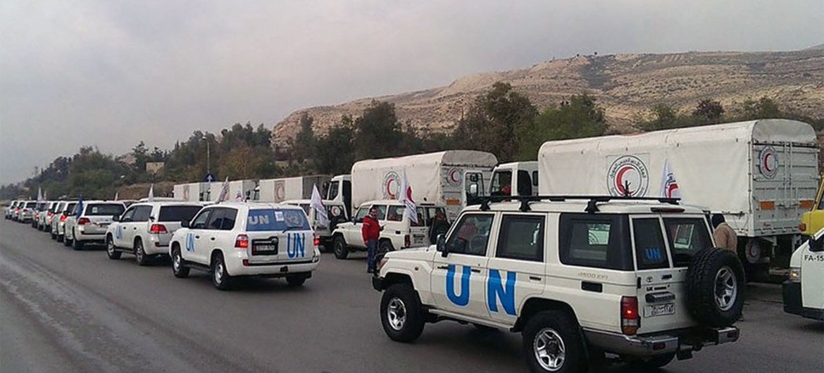 UN aid trucks arrive in the Syrian town of Madaya, which has been slowly starving since October 2015.