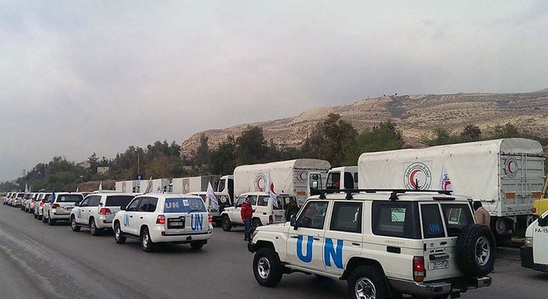 UN aid trucks arrive in the Syrian town of Madaya, which has been slowly starving since October 2015. 
